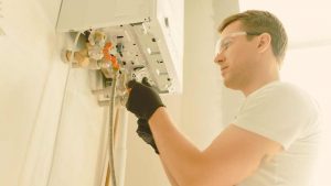 Manutenzione caldaia (Canva) Valsusanews.it